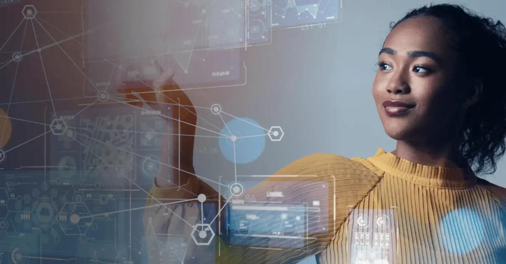 Mulher tocando uma parede de vidro em sua frente, que tem vários hologramas de gráficos.
